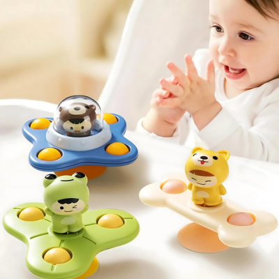 Doll suction spinner with rattle